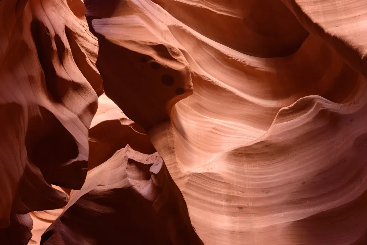 Layered sandstone corridor inside Lower Antelope Canyon, a stop on an Antelope Canyon tour from Las Vegas, Page, Arizona.